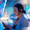 woman holding cell phone