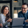 Two data scientists sitting at computer